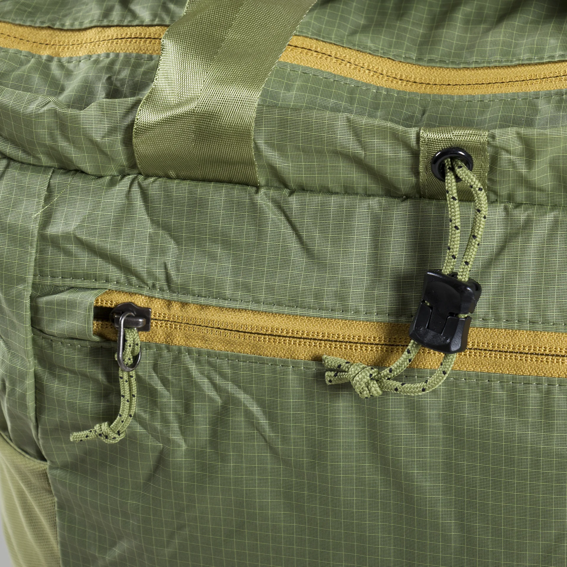 patagonia borealis green ultralight black hole tote pack small interior stash pocket Folded webbing handles for a comfortable carry Tote volume is 25 litres Made in a Fair Trade Certified factory Patagonia Recycled Ultralight Black Hole