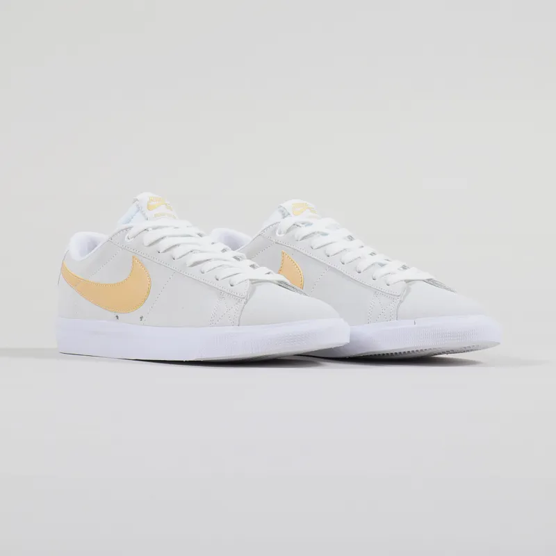 white blue and gold nike shoes